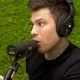 Fedez a Muschio Selvaggio parla di una nave per migranti con la sua faccia sopra